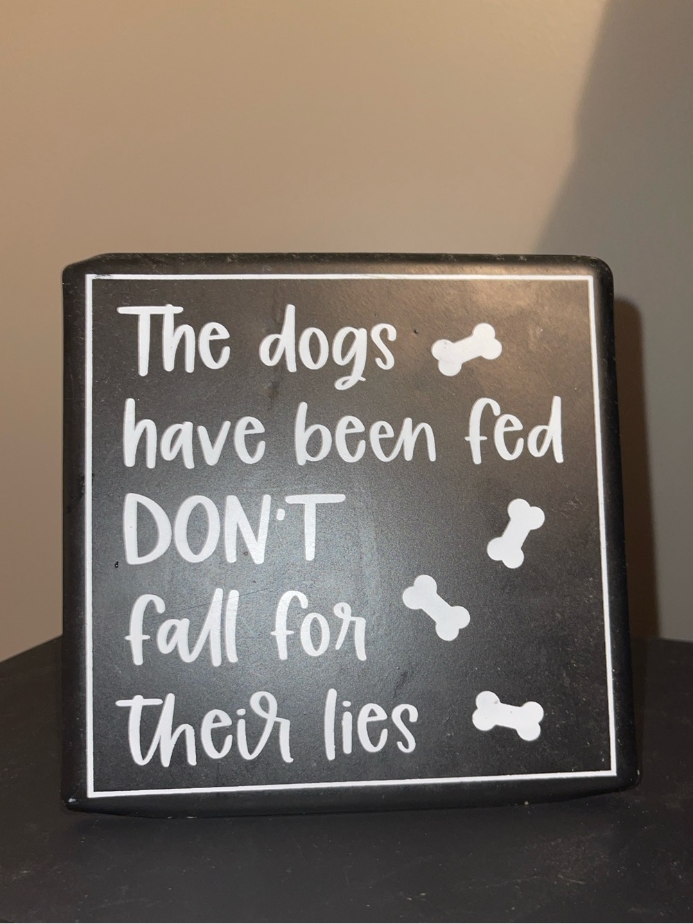 Black Dog Sign – 'The dogs have been fed DON'T fall for their lies'
